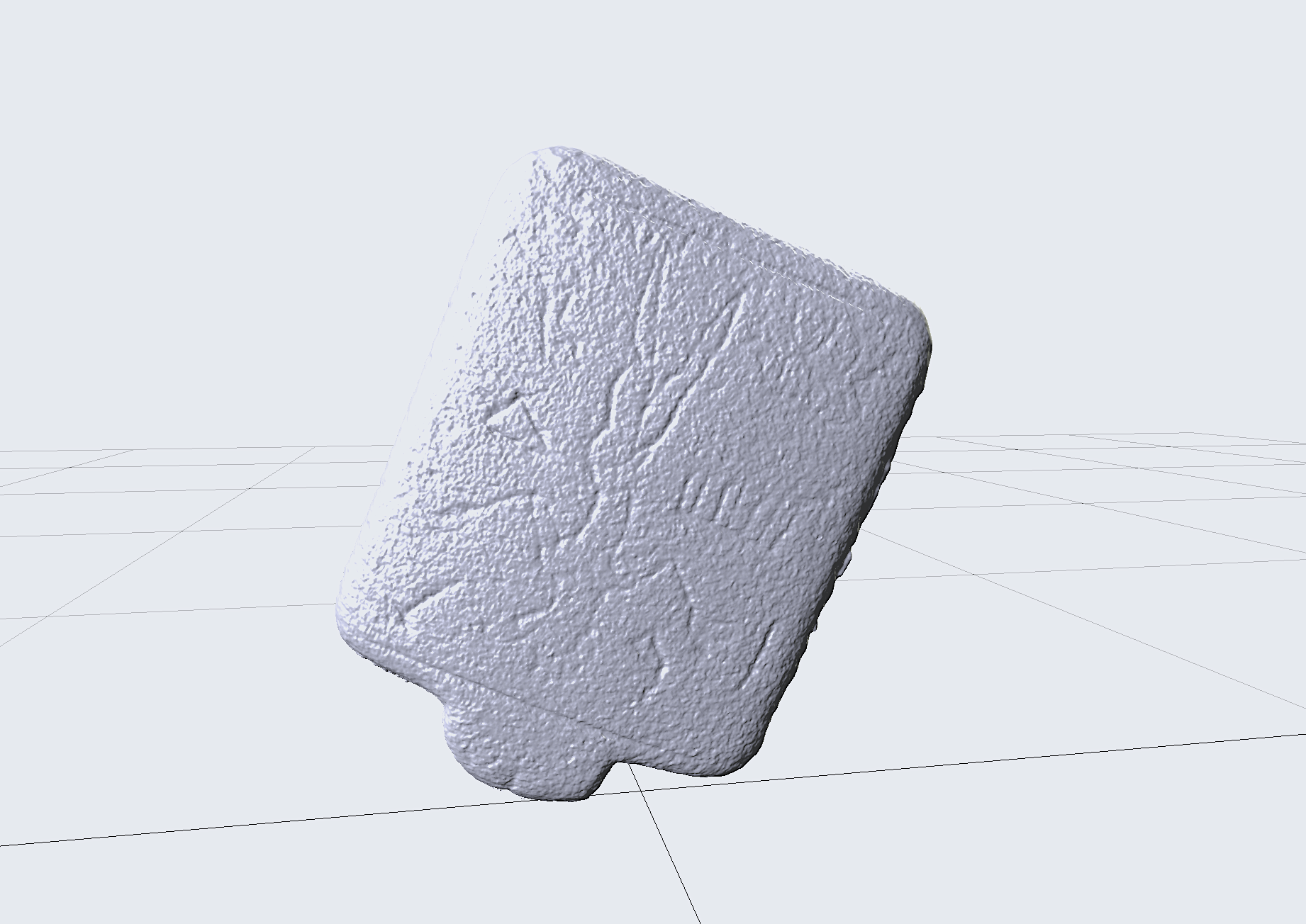 Amulet under digital light, showing incisions