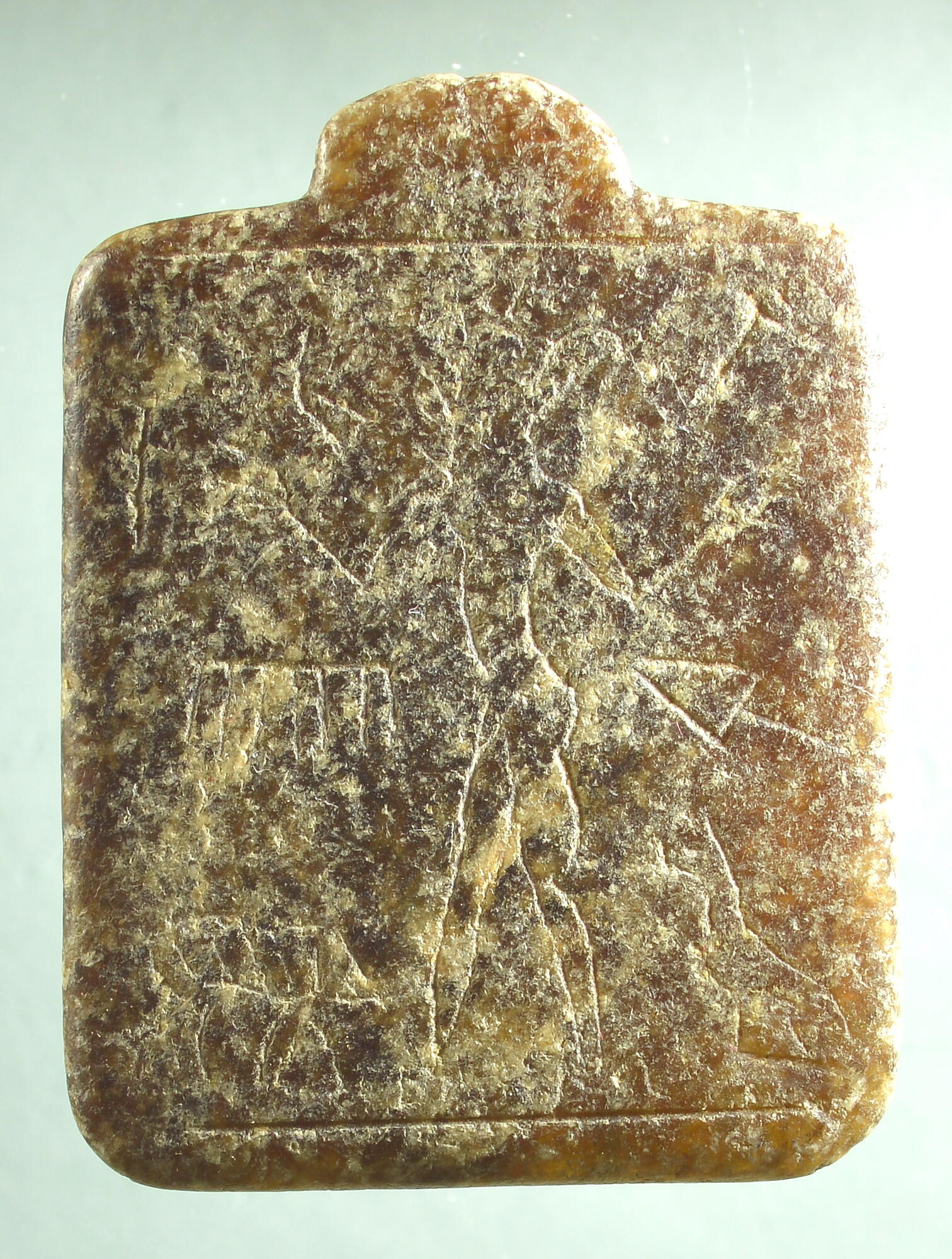 Lamashtu amulet with worn-down incisions